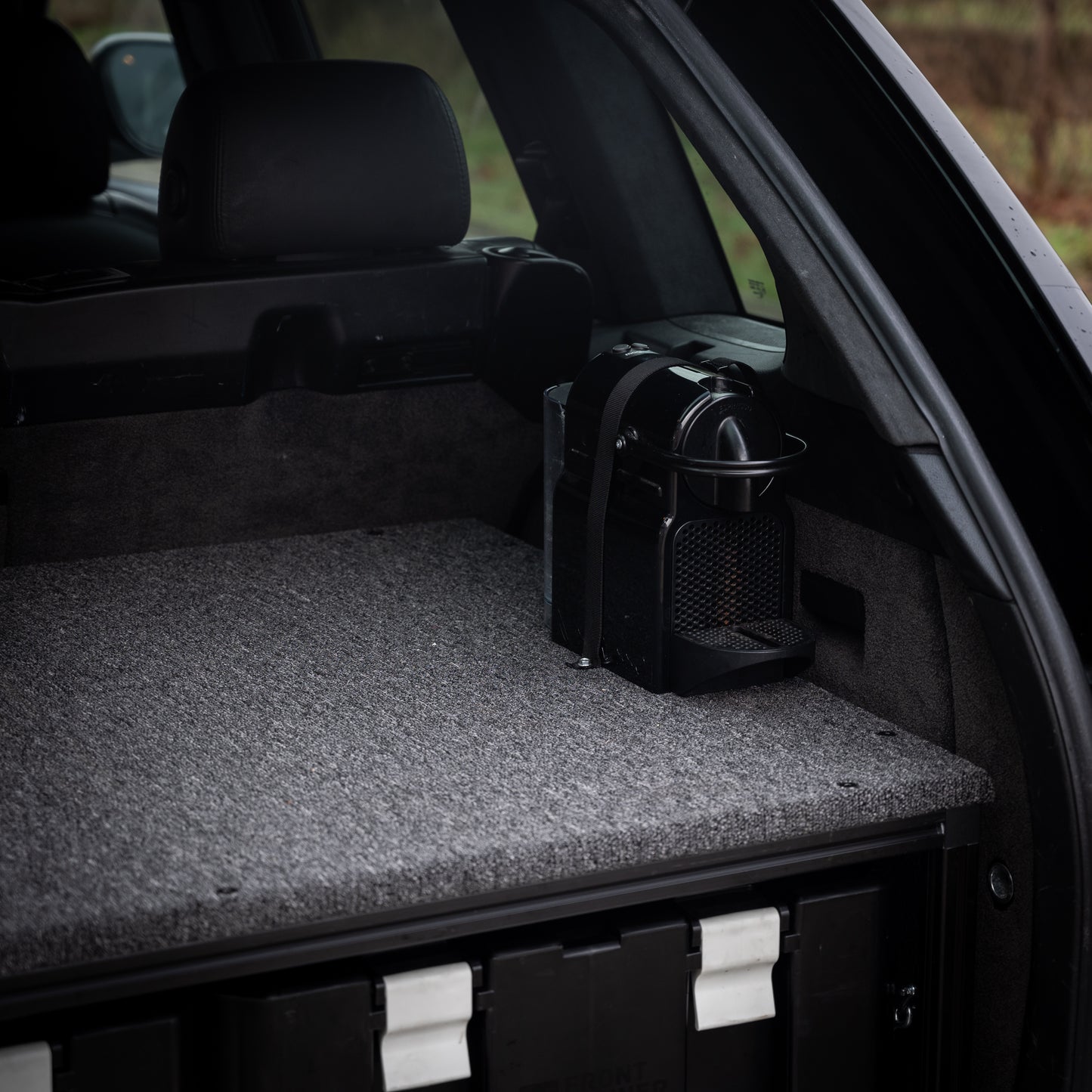 porsche cayenne platform achterin nespresso koffie